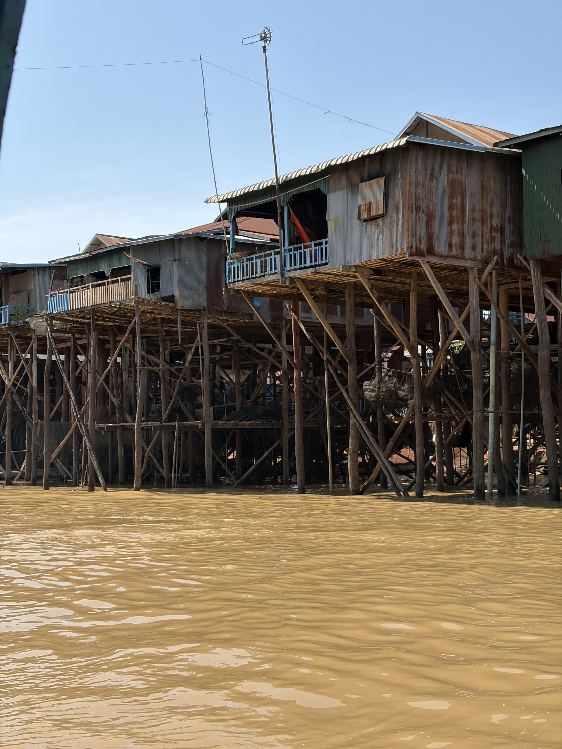Wooden stilt houses over a tributary of Tonle Sap, Kampong Phluk village
